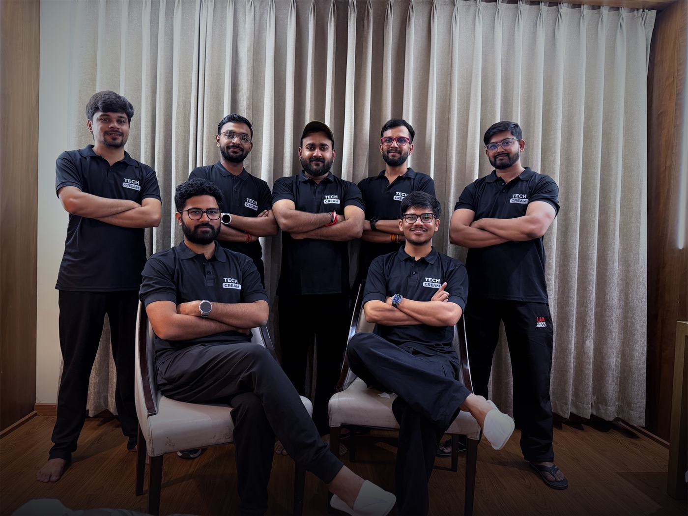 Team Techcream in matching black Techcream polos, arms crossed